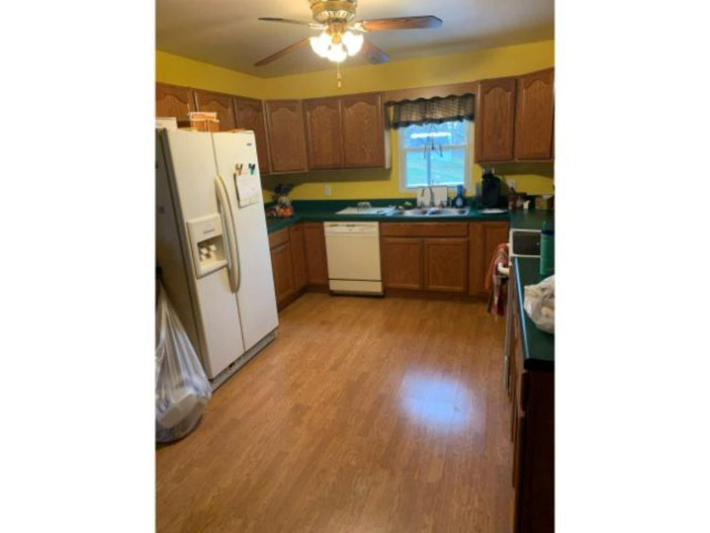773 McClane Farm Road Washington, PA 15301 - Photo 6 of 12 a kitchen with refrigerator and window