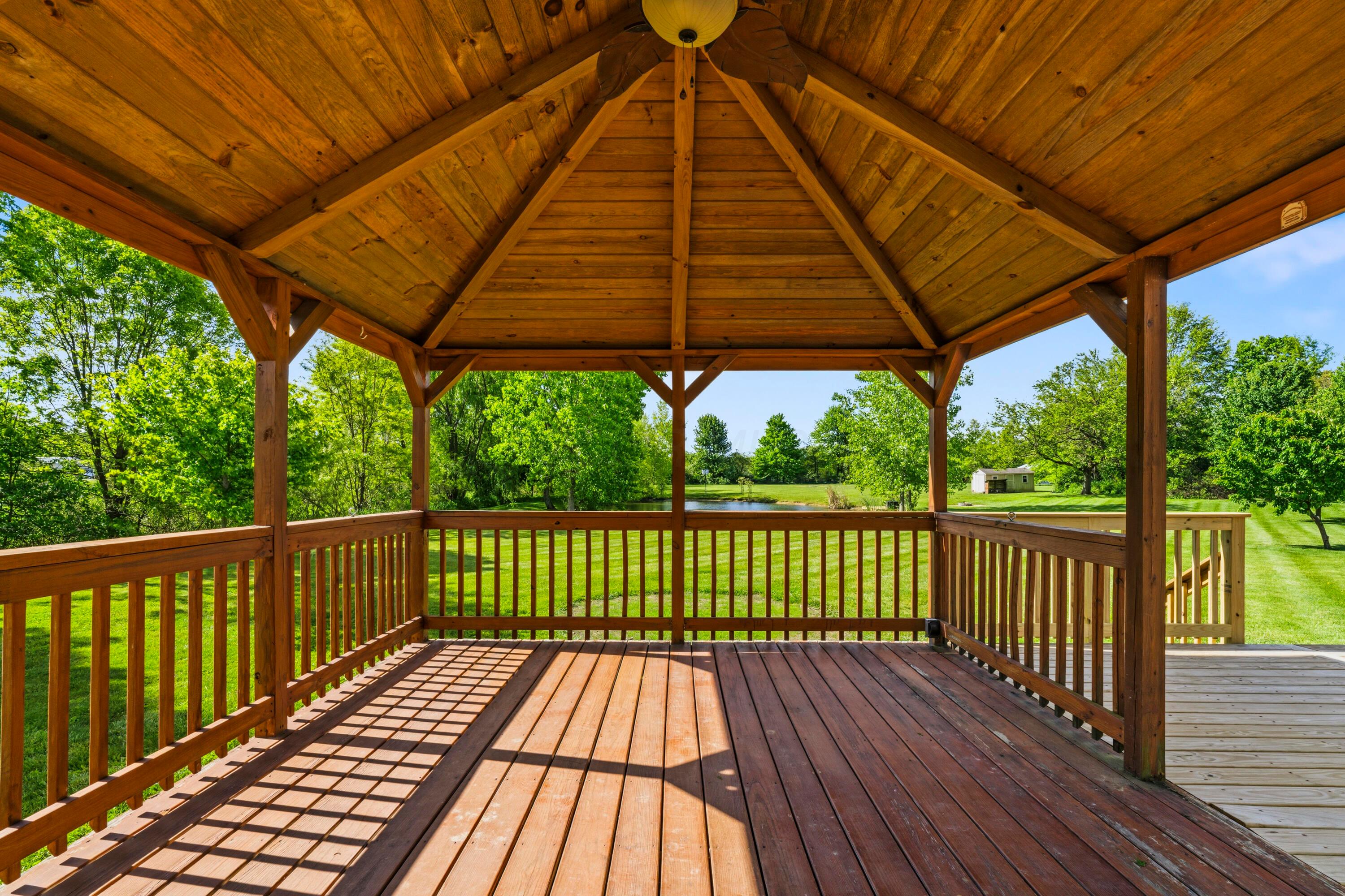 8507 Benner Road Johnstown, OH 43031 - Photo 48 of 69 NEW Deck in Fall of 2025 with metal roof gazebo, overlooking the acreage and pond!
