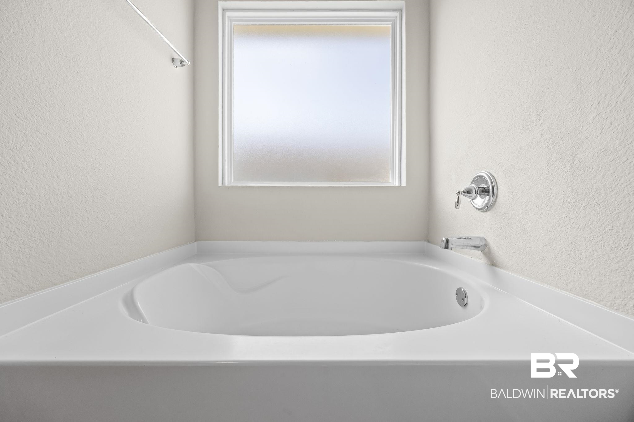 3090 Camino Real Loop Lillian, AL 36549 - Photo 28 of 29 Full bathroom featuring a textured wall and a bath