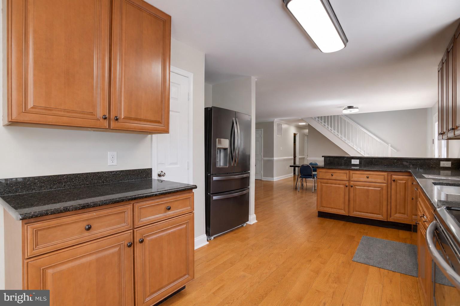 10461 Old Stillhouse Road Boston, VA 22713 - Photo 7 of 63 Modern kitchen with warm wood tones.