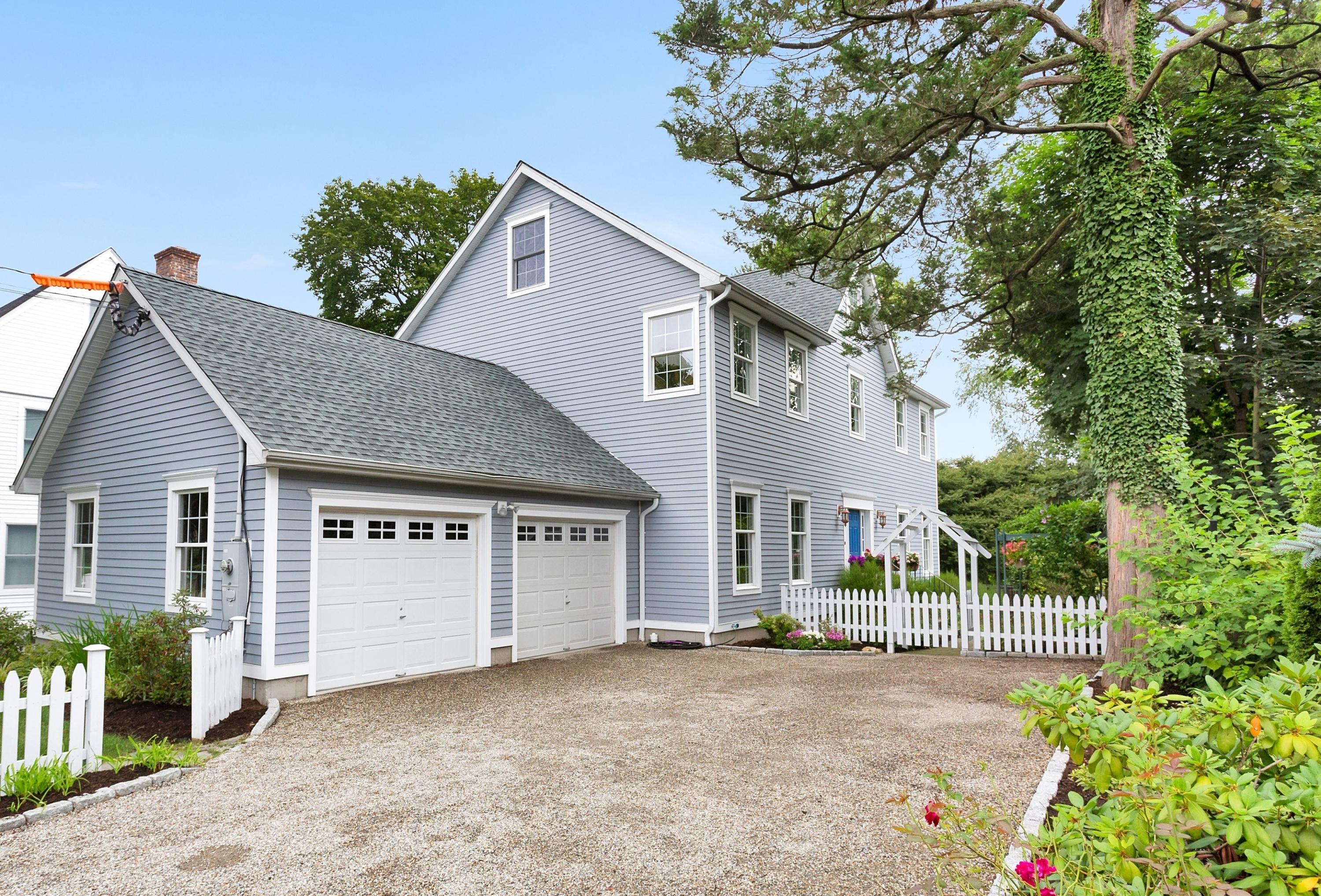 28 Dickinson Road Darien, CT 06820 - Photo 2 of 42 a front view of a house with a garden