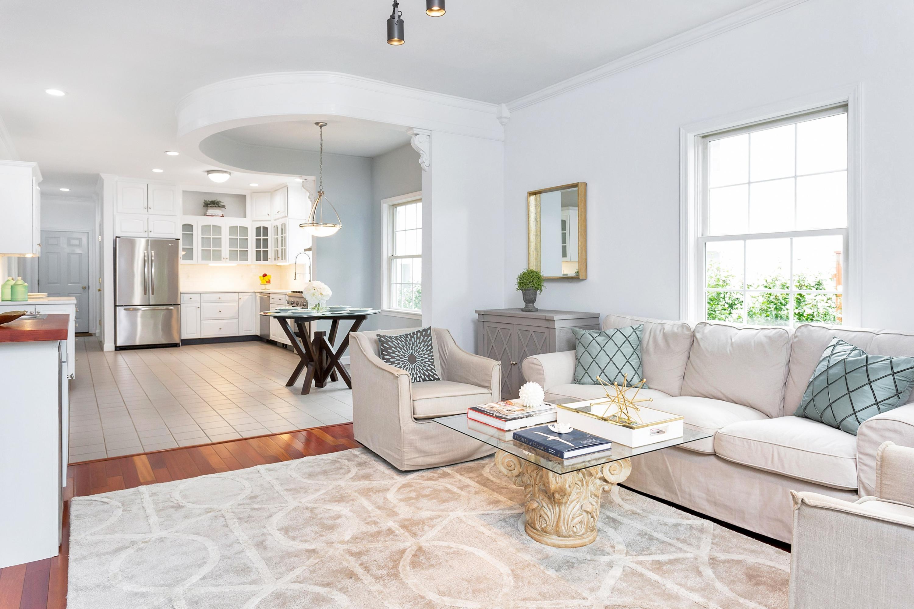 28 Dickinson Road Darien, CT 06820 - Photo 12 of 42 a living room with furniture and a table