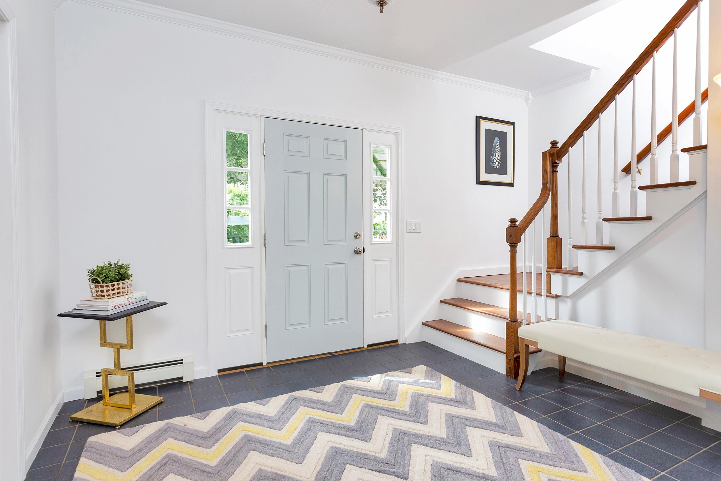 28 Dickinson Road Darien, CT 06820 - Photo 21 of 42 a view of entryway with stairs and furniture