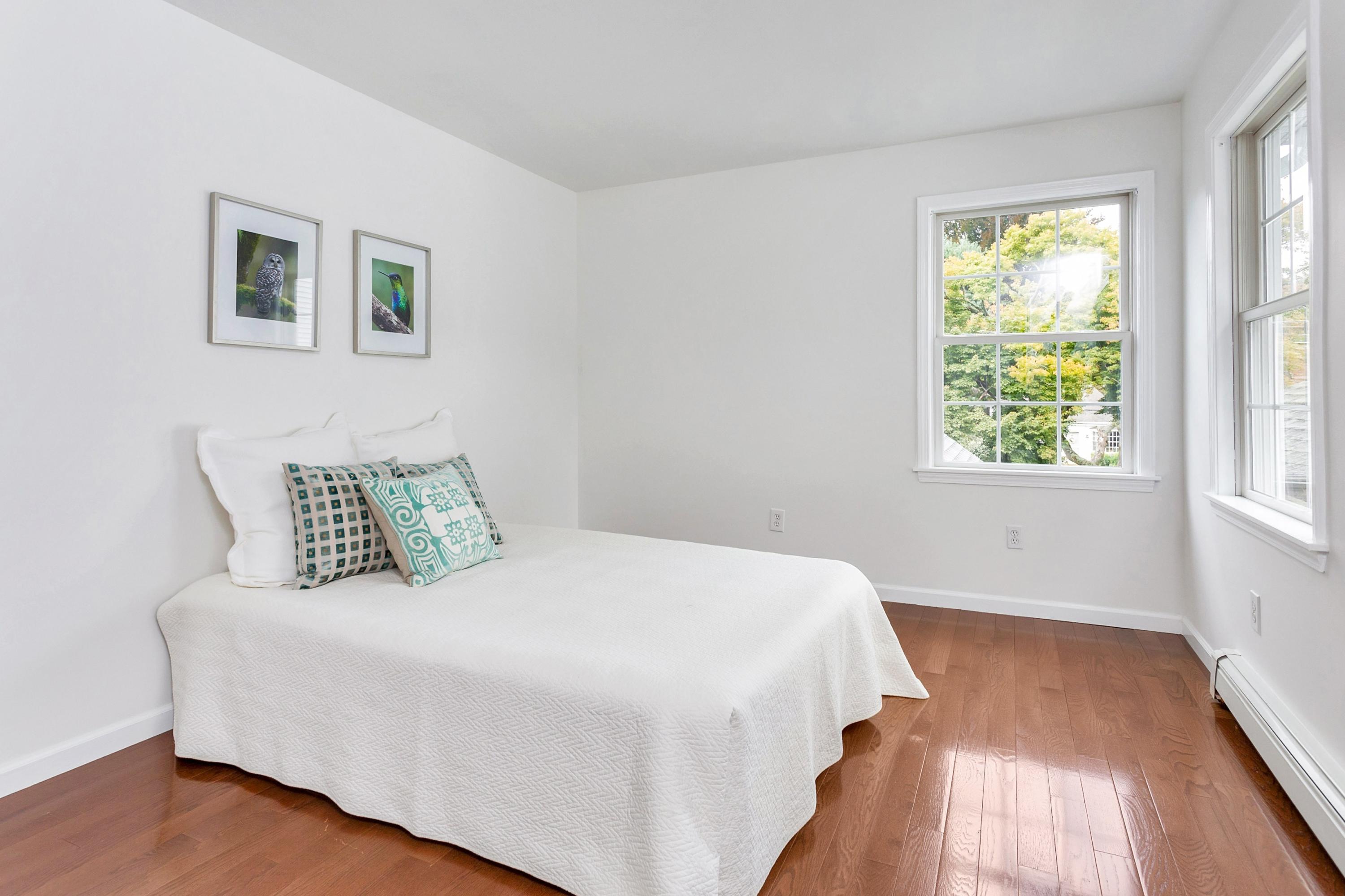 28 Dickinson Road Darien, CT 06820 - Photo 25 of 42 a bedroom with a bed and a window