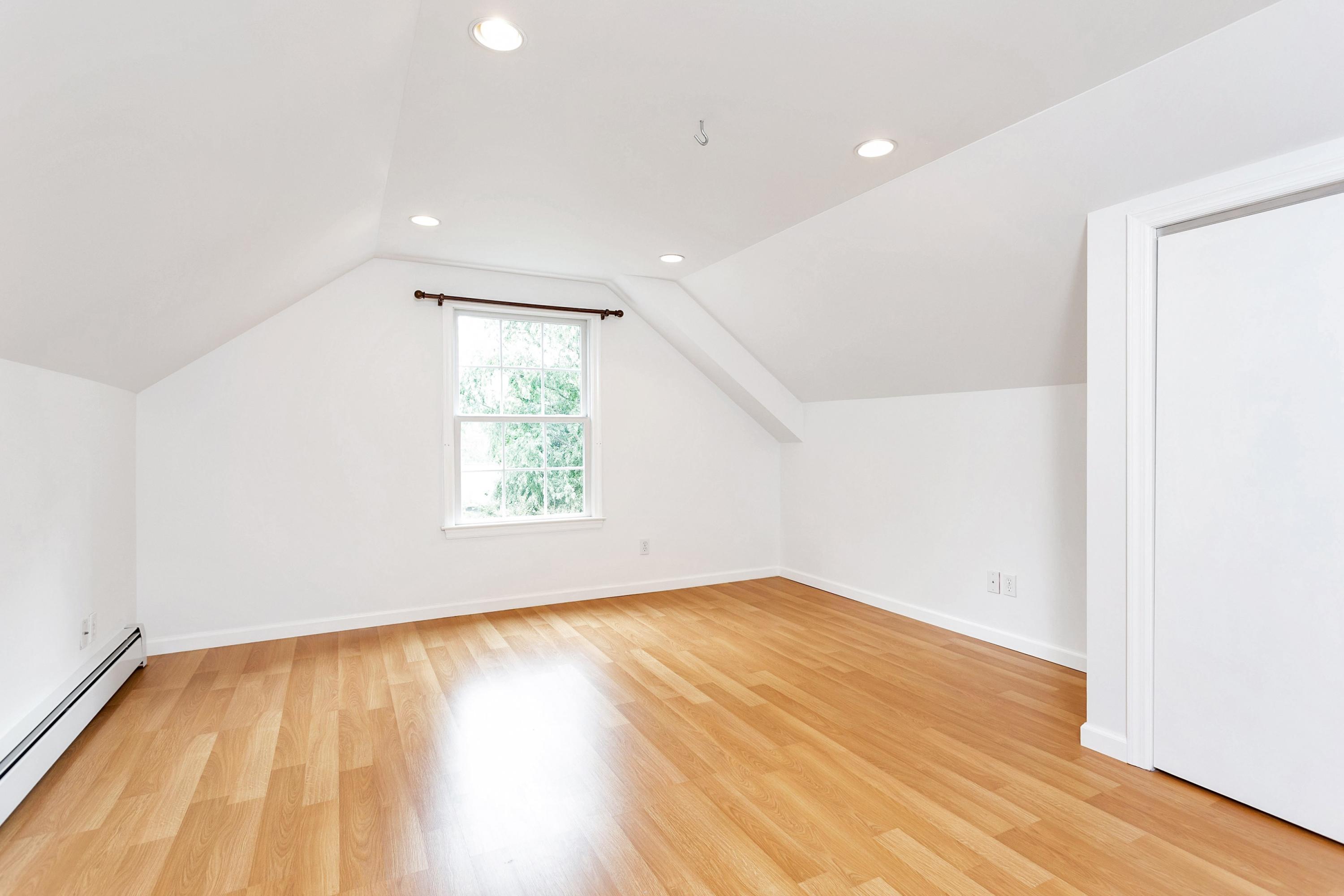 28 Dickinson Road Darien, CT 06820 - Photo 29 of 42 an empty room with wooden floor and windows