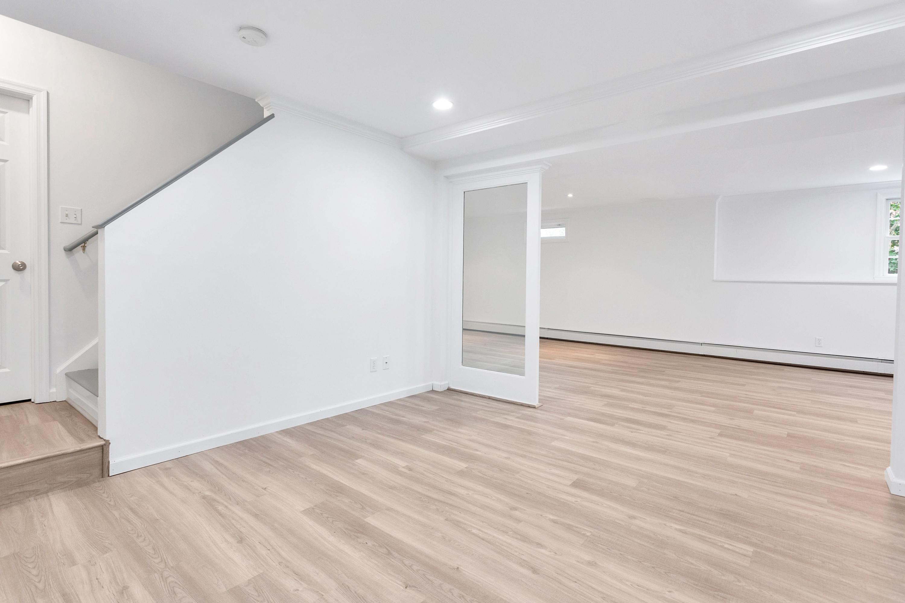 28 Dickinson Road Darien, CT 06820 - Photo 32 of 42 a view of an empty room with wooden floor