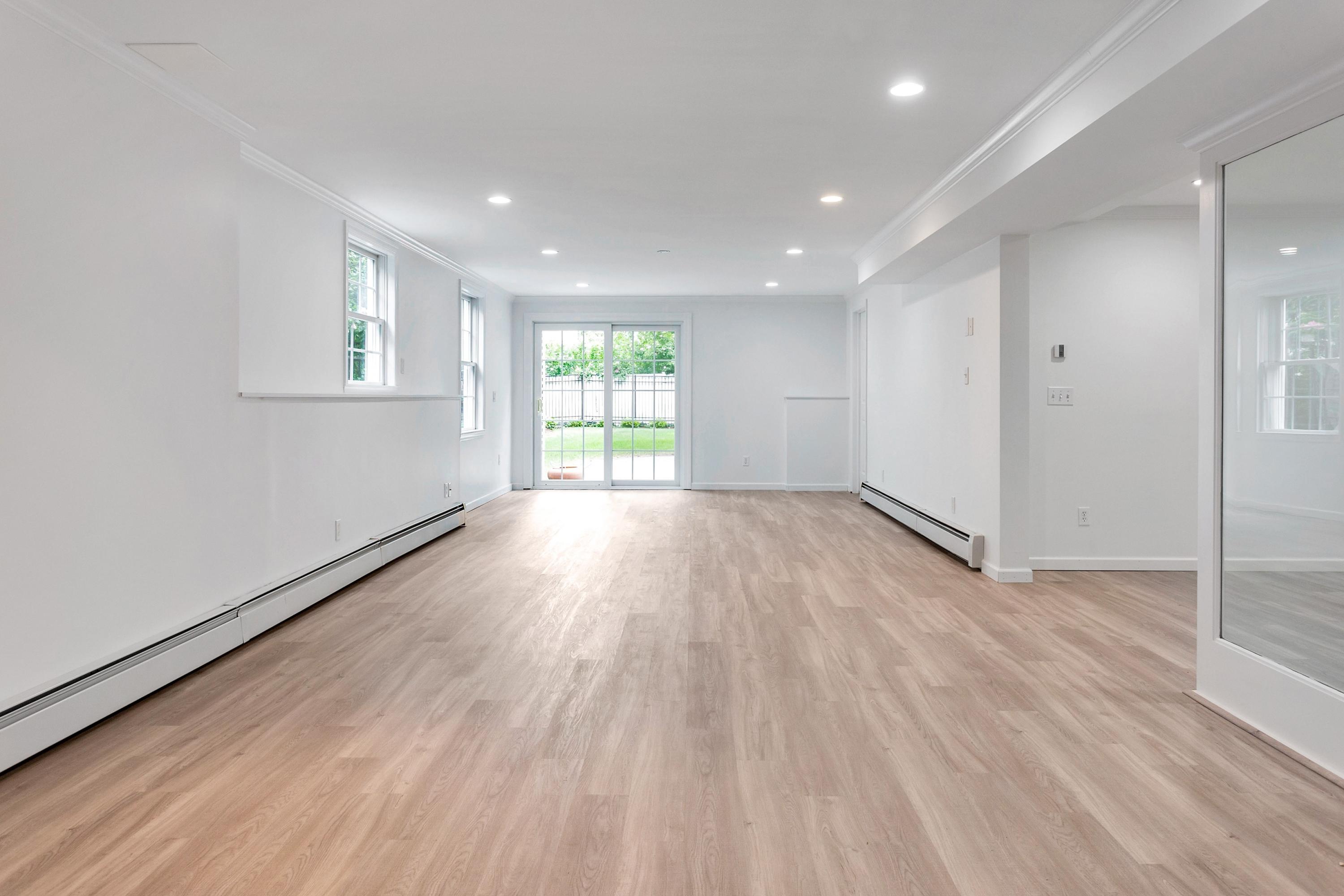 28 Dickinson Road Darien, CT 06820 - Photo 33 of 42 wooden floor in an empty room with a window
