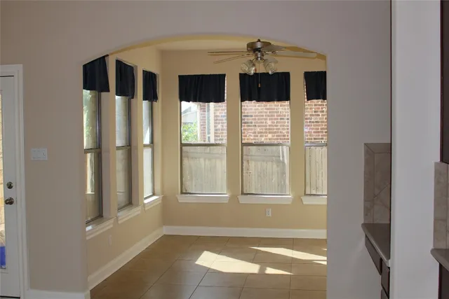 a kitchen with stainless steel appliances a refrigerator and cabinets