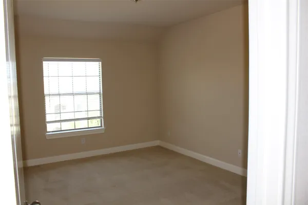 a picture of a room with a white wall and white walls