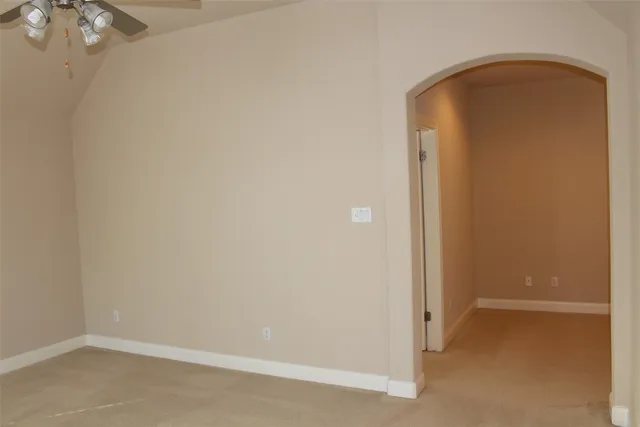 a view of a house with a yard and large tree