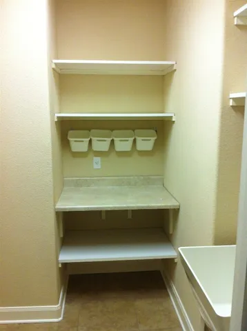 a view of a house with a yard and plants