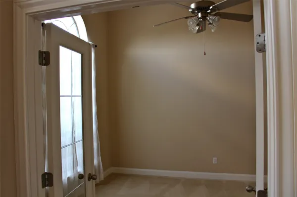 a view of a storage & utility room with a window