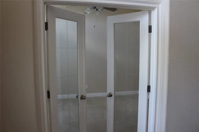 a view of a storage & utility room with a window