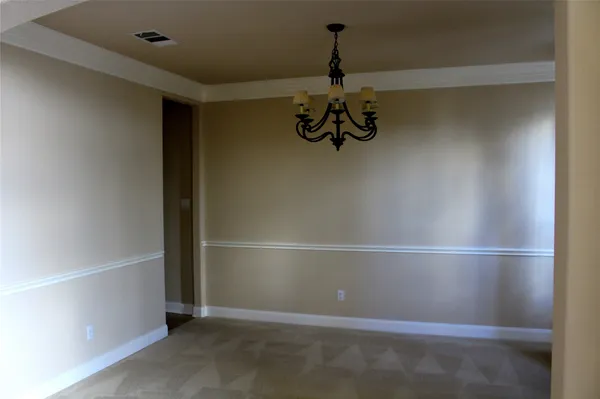 a kitchen with stainless steel appliances granite countertop a refrigerator and a stove