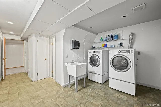an aerial view of a house with a yard and table and chairs