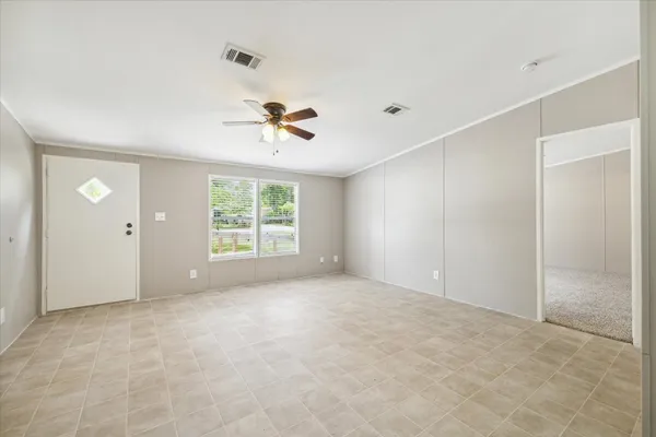 a view of an empty room with a window