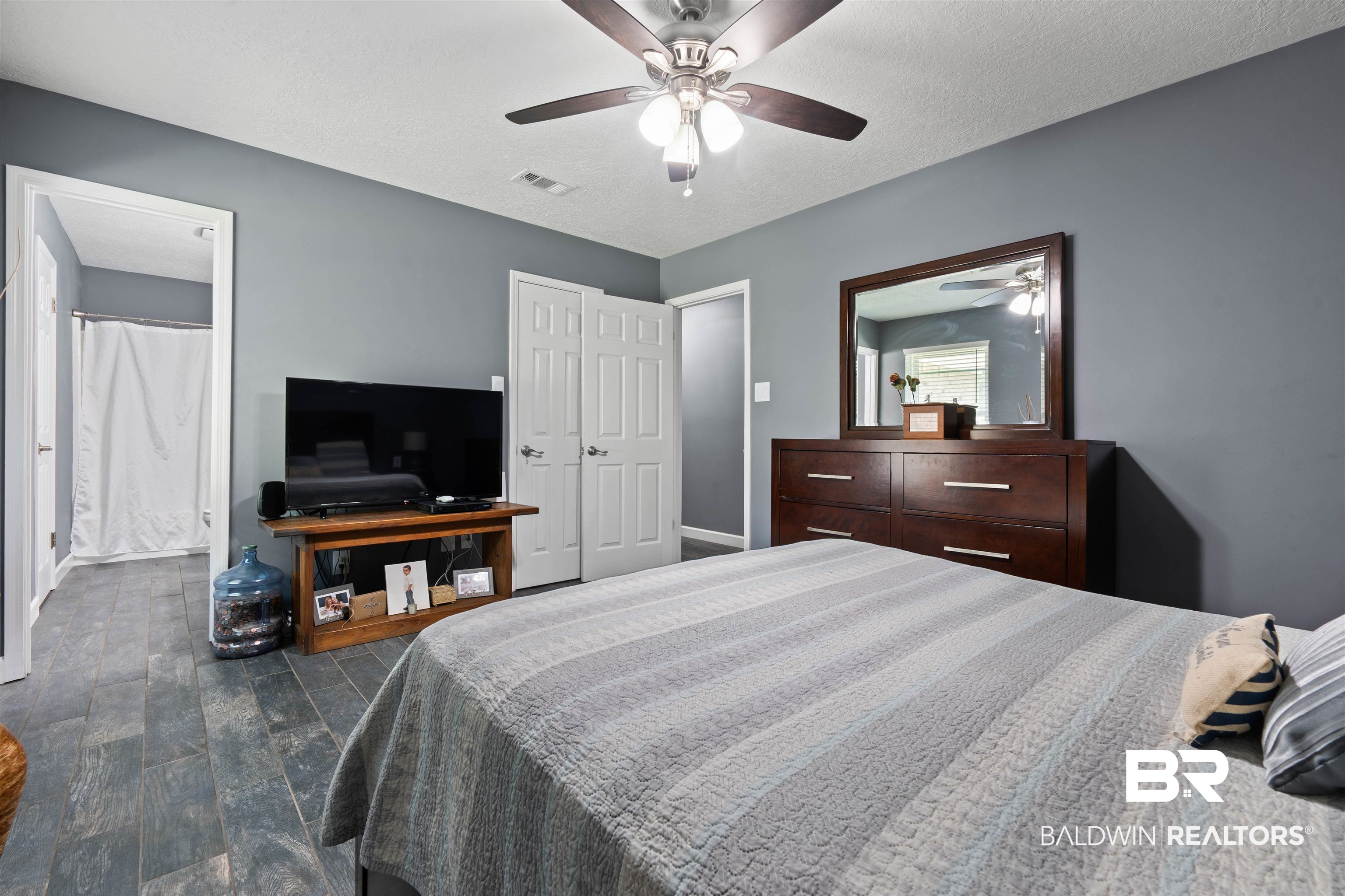 2000 Campfire Drive Semmes, AL 36575 - Photo 13 of 26 Bedroom featuring dark hardwood / wood-style flooring, a textured ceiling, and ceiling fan