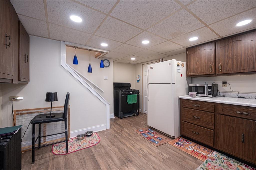 15 Old Soose Road, Unit A Pittsburgh, PA 15209 - Photo 7 of 27 a view of kitchen with cabinets and wooden floor