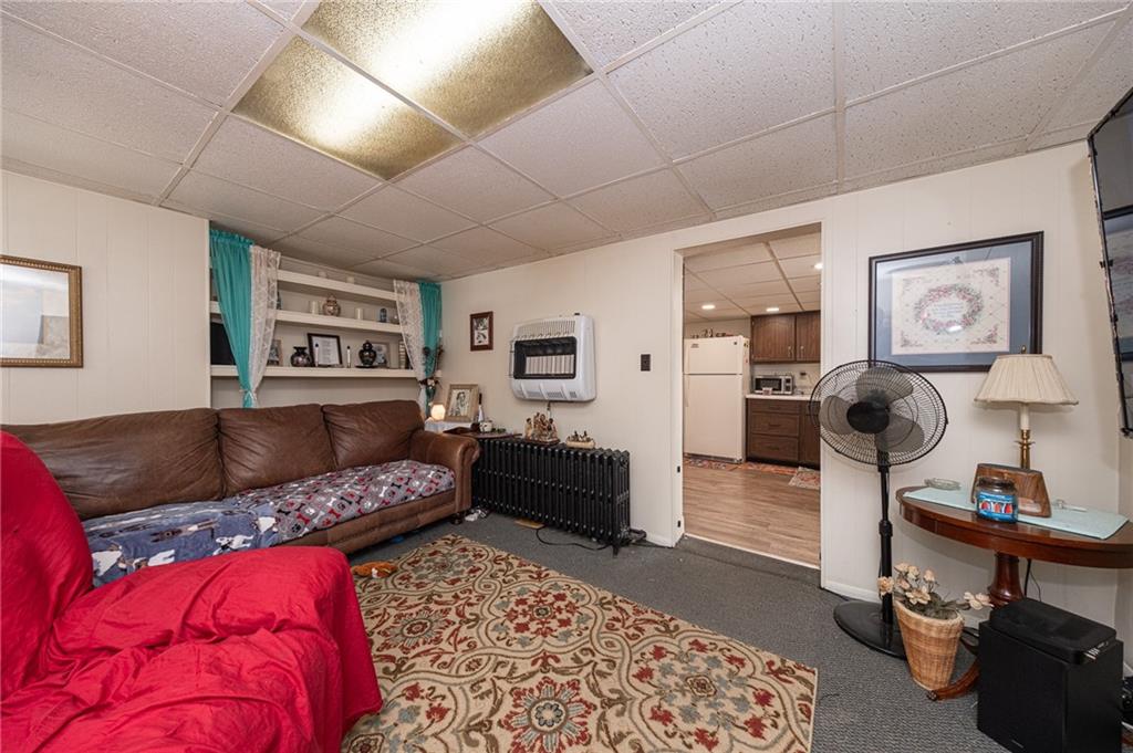 15 Old Soose Road, Unit A Pittsburgh, PA 15209 - Photo 10 of 27 a living room with furniture and a rug