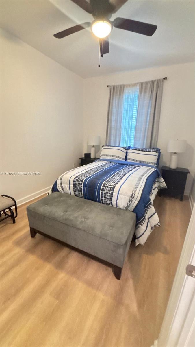 25380 Southwest 115th Court Homestead, FL 33032 - Photo 21 of 32 a bedroom with bed and window