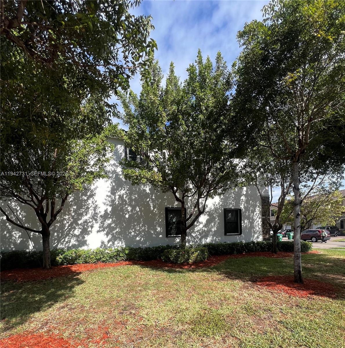 25380 Southwest 115th Court Homestead, FL 33032 - Photo 27 of 32 a view of house with yard