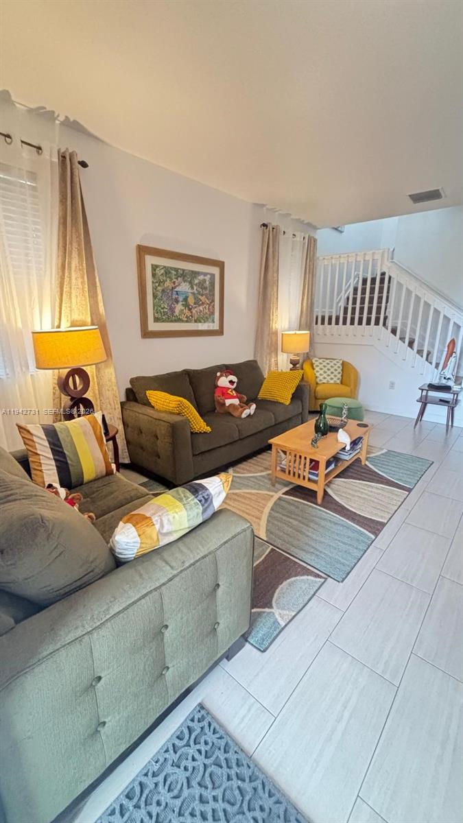 25380 Southwest 115th Court Homestead, FL 33032 - Photo 3 of 32 a living room with furniture and a couch