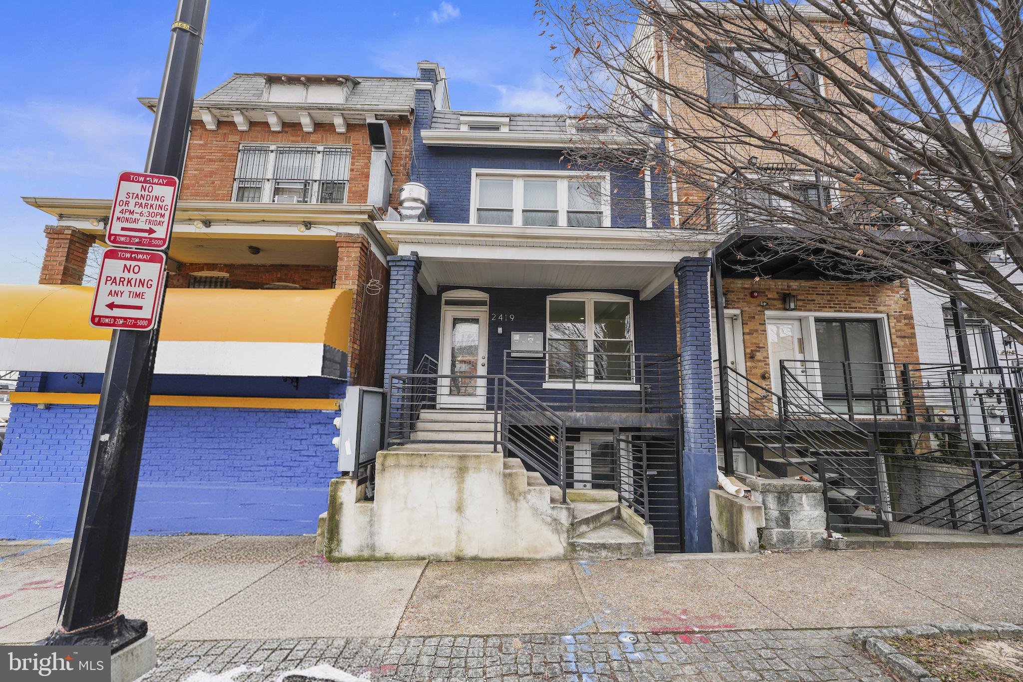 2419 Benning Road Northeast Washington, DC 20002 - Photo 4 of 22 a front view of a house with glass windows