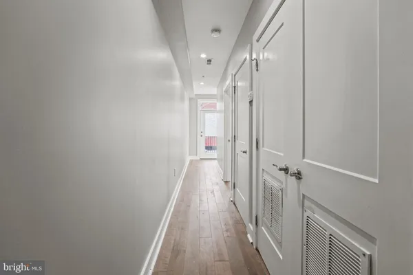 a view of a hallway with a white walls
