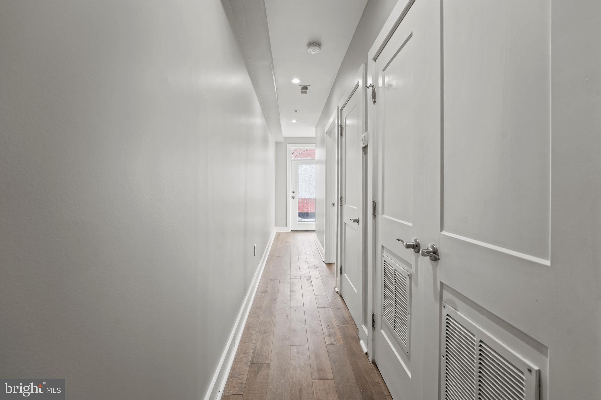 2419 Benning Road Northeast Washington, DC 20002 - Photo 9 of 22 a view of a hallway with a white walls