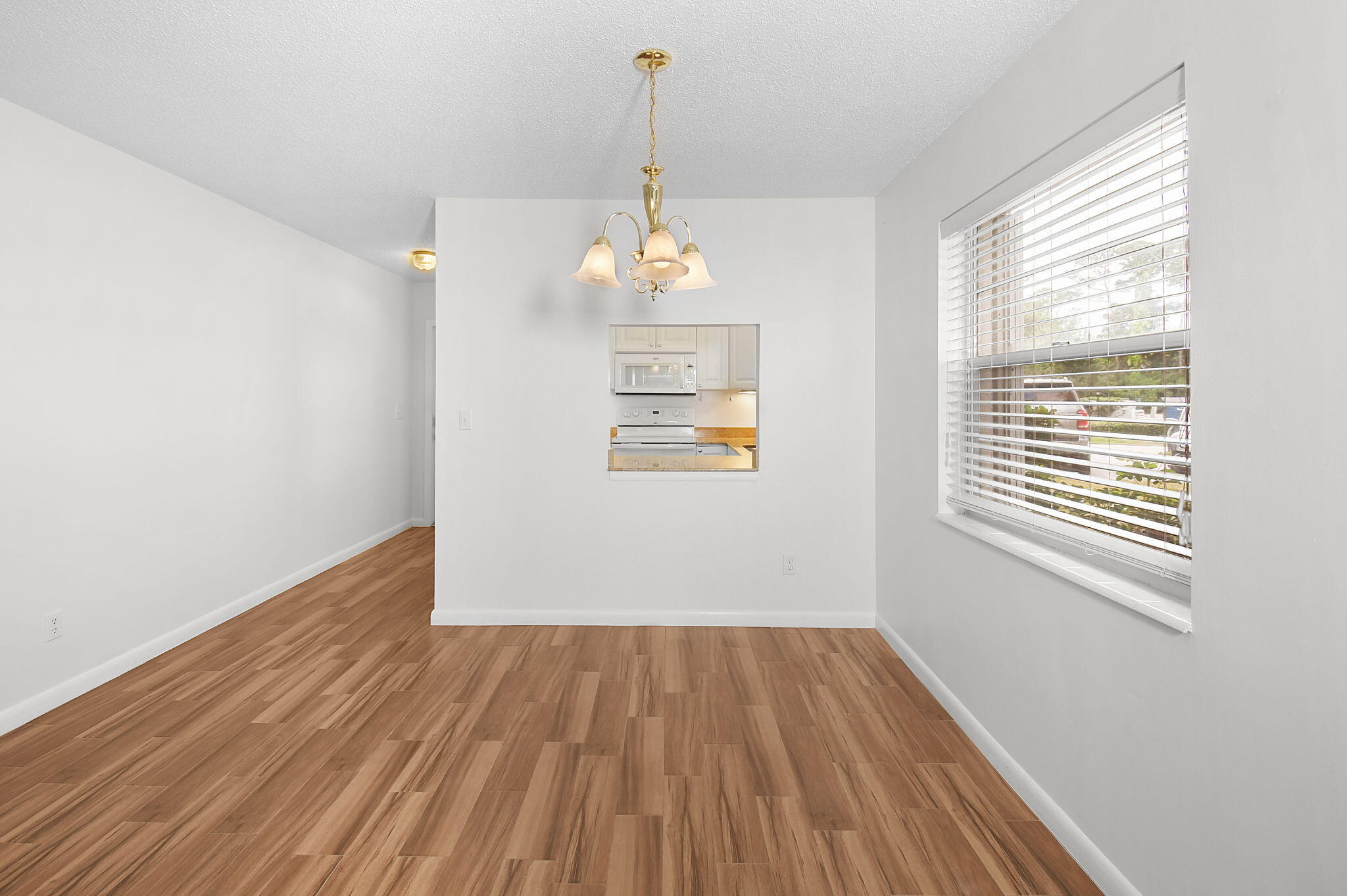 2600 Southeast Ocean Boulevard, Unit S7 Stuart, FL 34996 - Photo 12 of 38 wooden floor in an empty room with a window