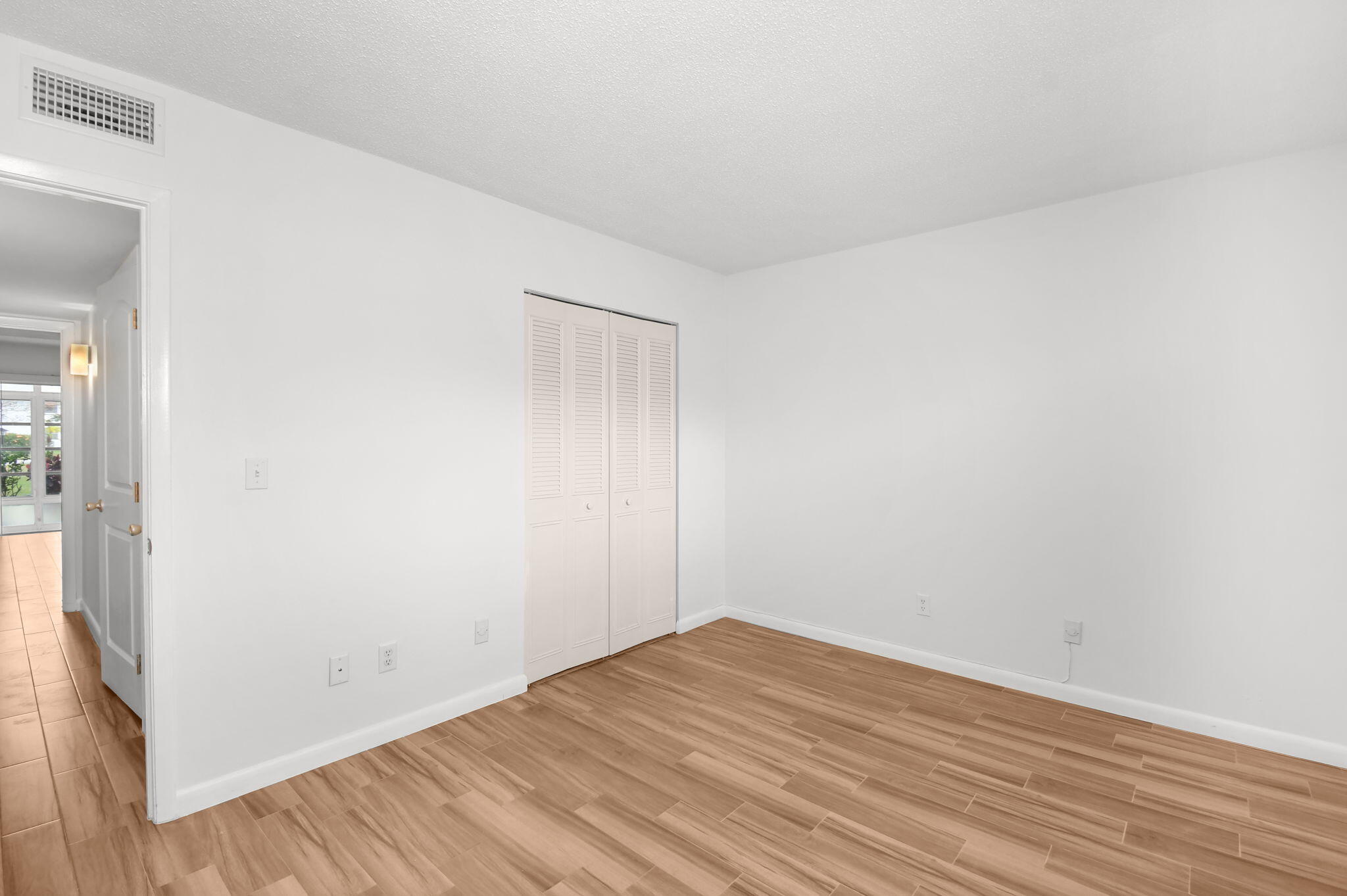 2600 Southeast Ocean Boulevard, Unit S7 Stuart, FL 34996 - Photo 17 of 38 a view of empty room with wooden floor