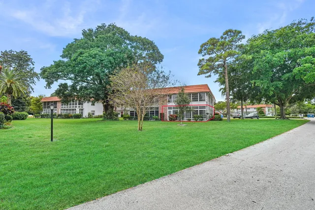 a view of swimming pool with outdoor seating and lake view