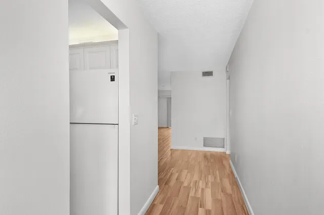 a view of a bedroom from a hallway