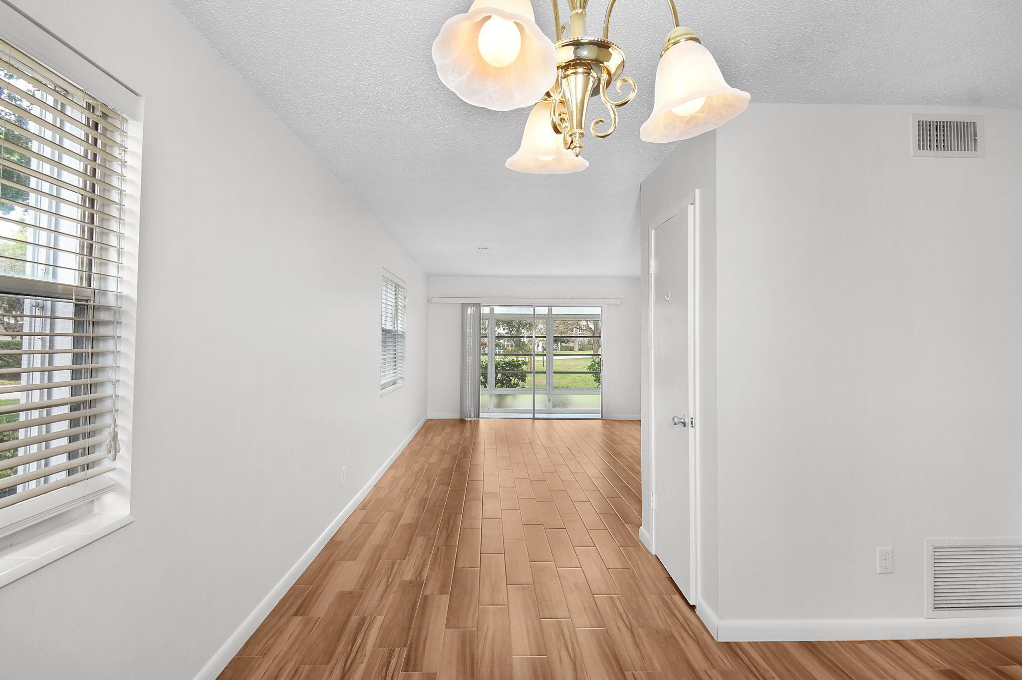 2600 Southeast Ocean Boulevard, Unit S7 Stuart, FL 34996 - Photo 9 of 38 a view of a room with wooden floor and a window