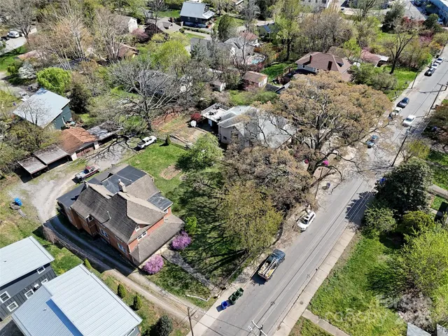 an aerial view of residential house and green space