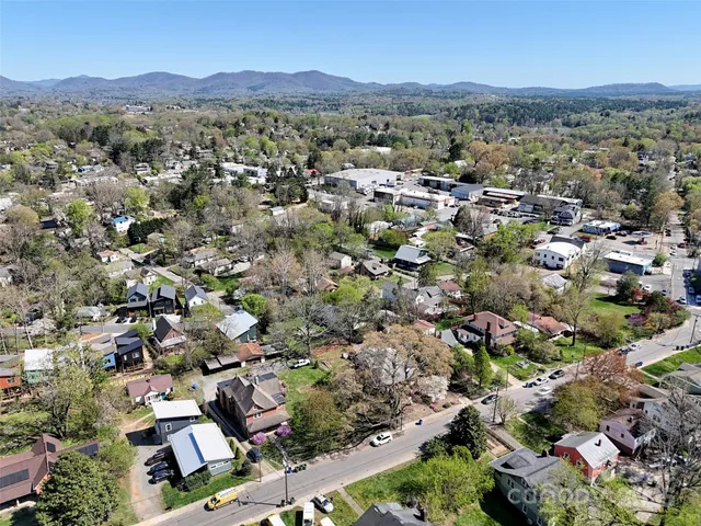 an aerial view of a town with couple of houses