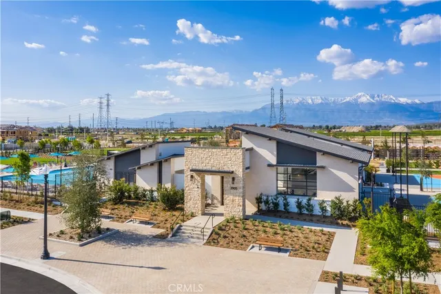 a view of a swimming pool with outdoor seating