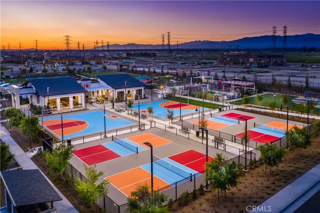 a view of a house with backyard sitting area and garden