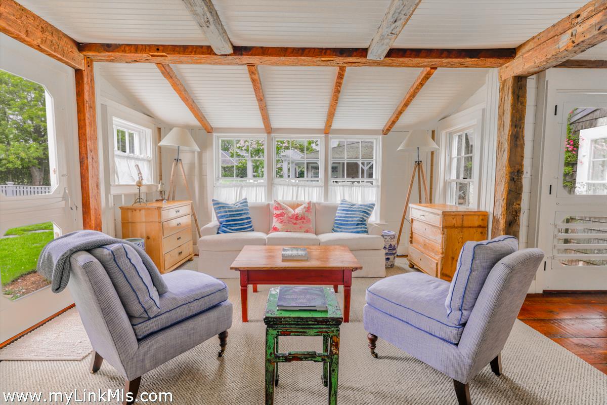 14 & 16 Coffin Street Nantucket, MA 02554 - Photo 29 of 50 a living room with furniture a fireplace and a window