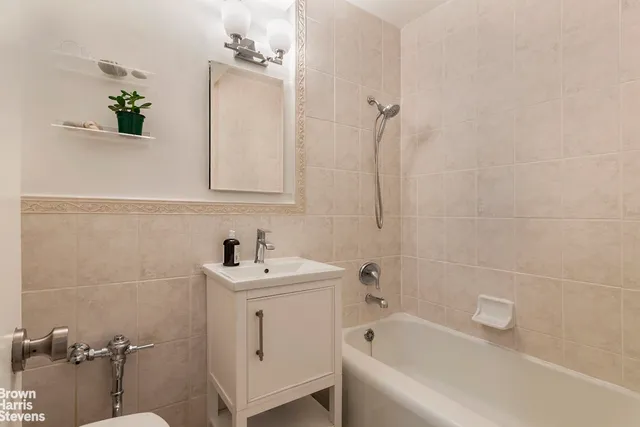 a bedroom with furniture and a chandelier