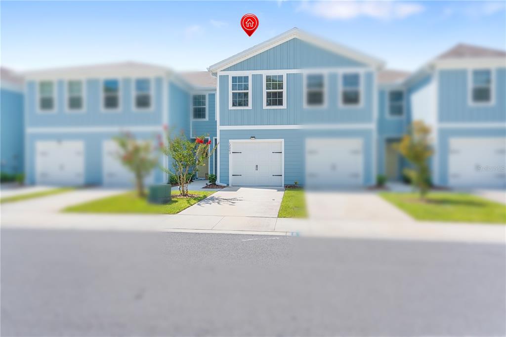 12003 Grizzly Lane New Port Richey, FL 34654 - Photo 3 of 43 a view of a house with a swimming pool