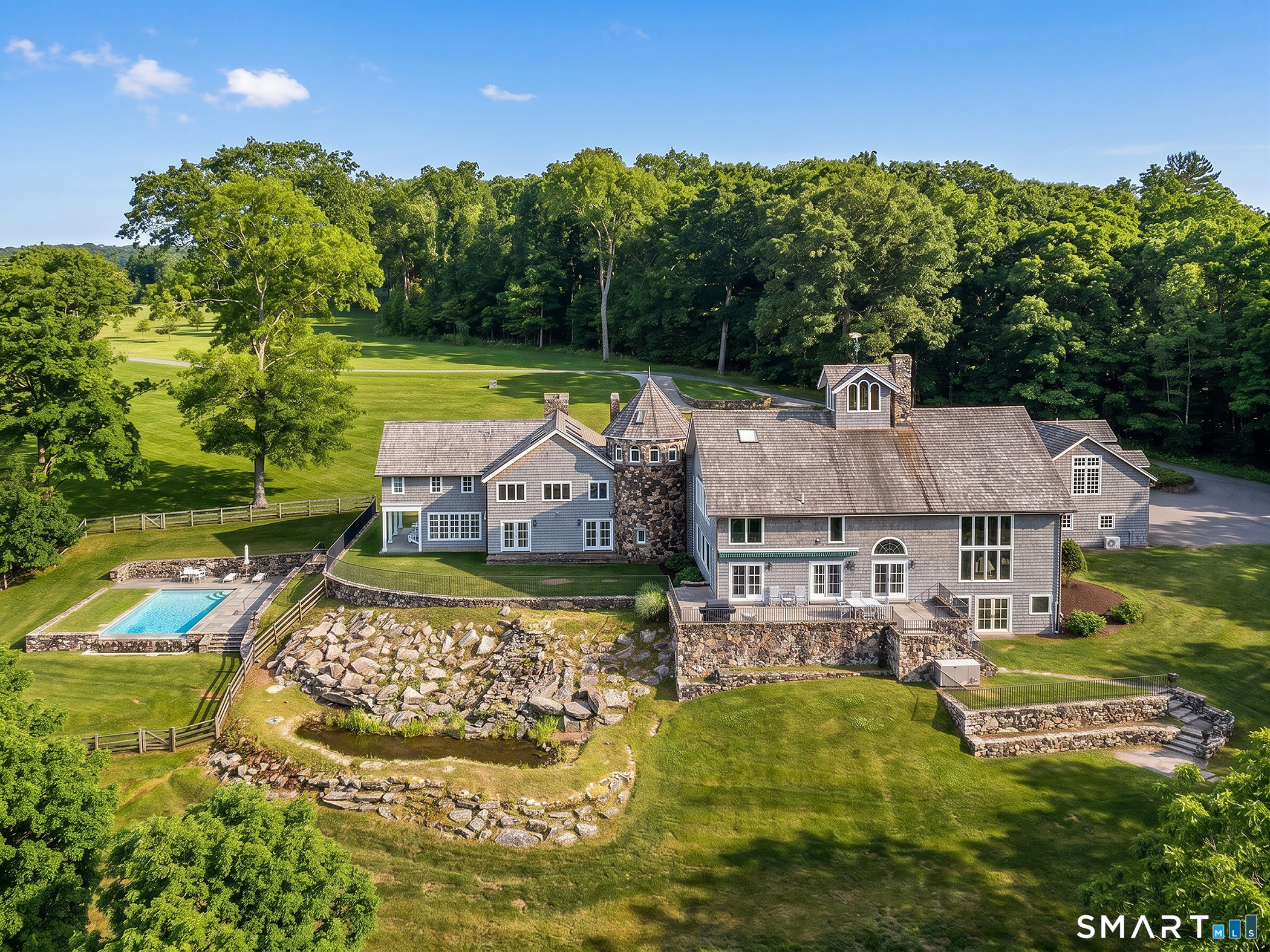 56 West Morris Road Washington, CT 06794 - Photo 38 of 40 an aerial view of a house with a garden and swimming pool