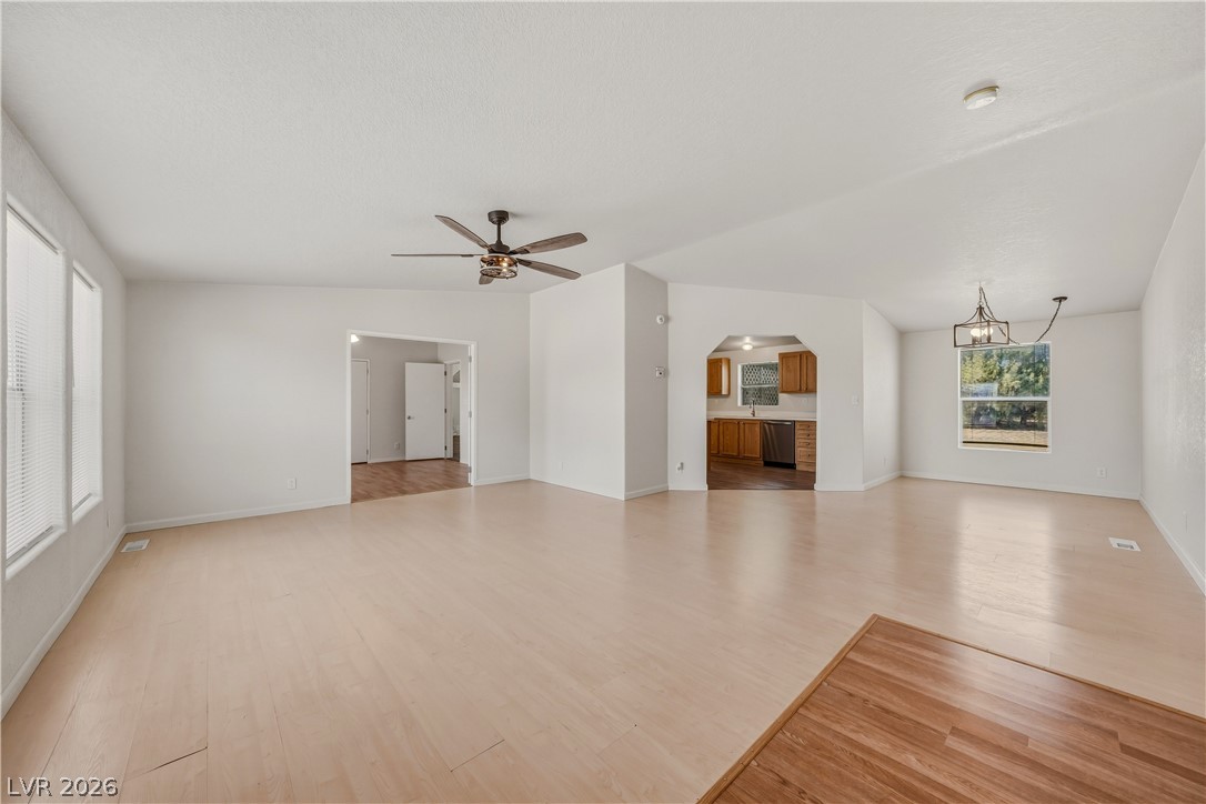 1890 West Dyer Road Pahrump, NV 89048 - Photo 21 of 40 This bright and open living area features a harmonious blend of natural light and stylish flooring.