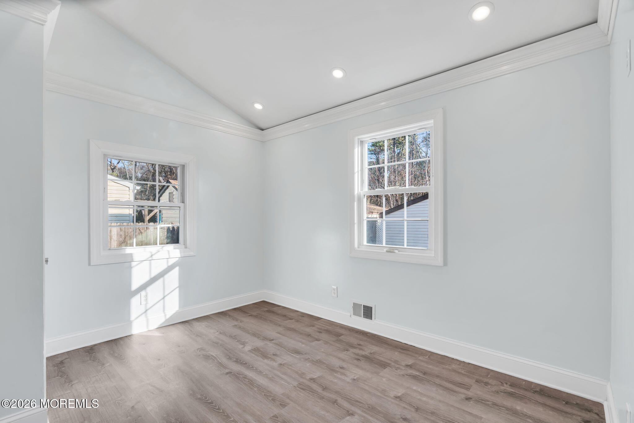 905 Harrison Road Toms River, NJ 08753 - Photo 15 of 41 a view of an empty room with wooden floor and a window