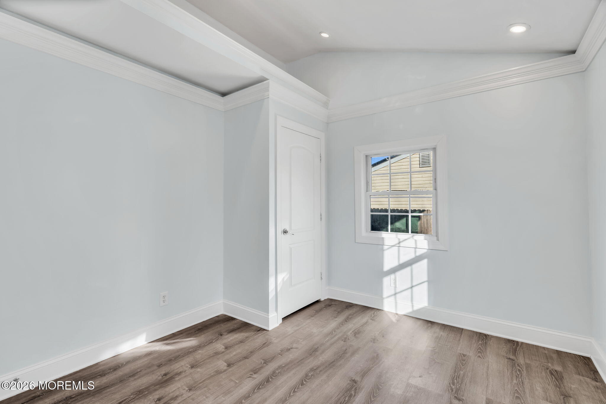 905 Harrison Road Toms River, NJ 08753 - Photo 16 of 41 an empty room with wooden floor and windows