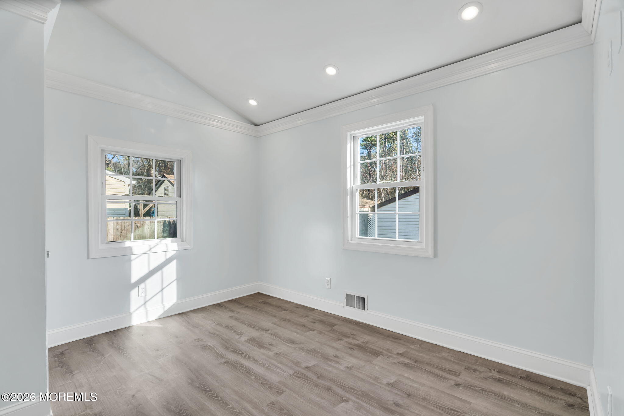 905 Harrison Road Toms River, NJ 08753 - Photo 17 of 41 a view of an empty room with wooden floor and a window