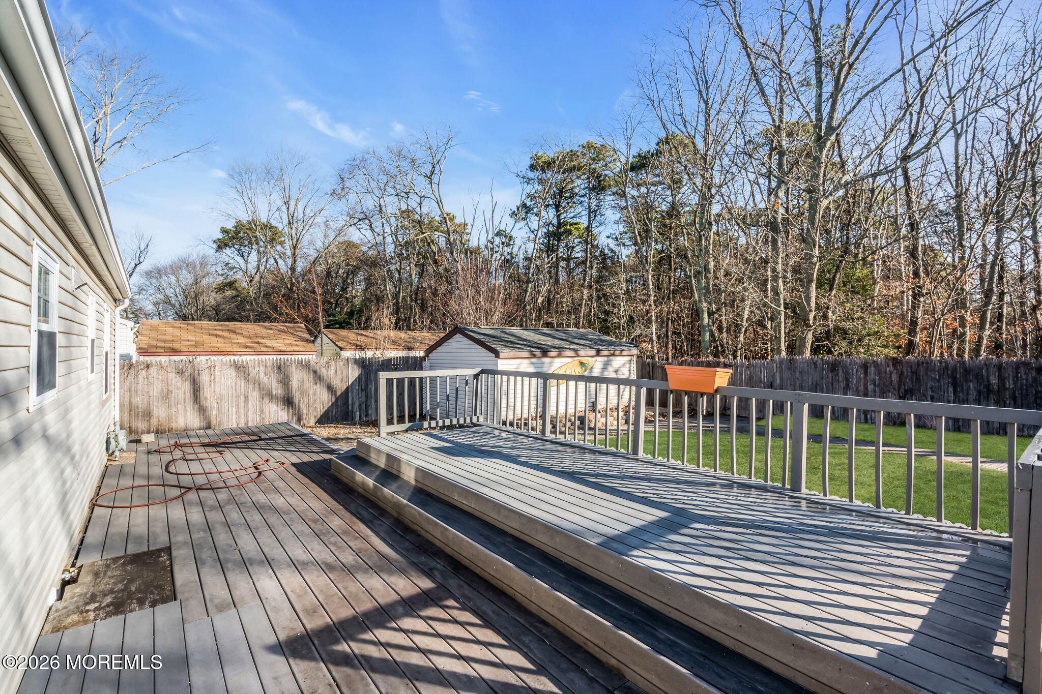 905 Harrison Road Toms River, NJ 08753 - Photo 20 of 41 a view of a wooden deck with trees