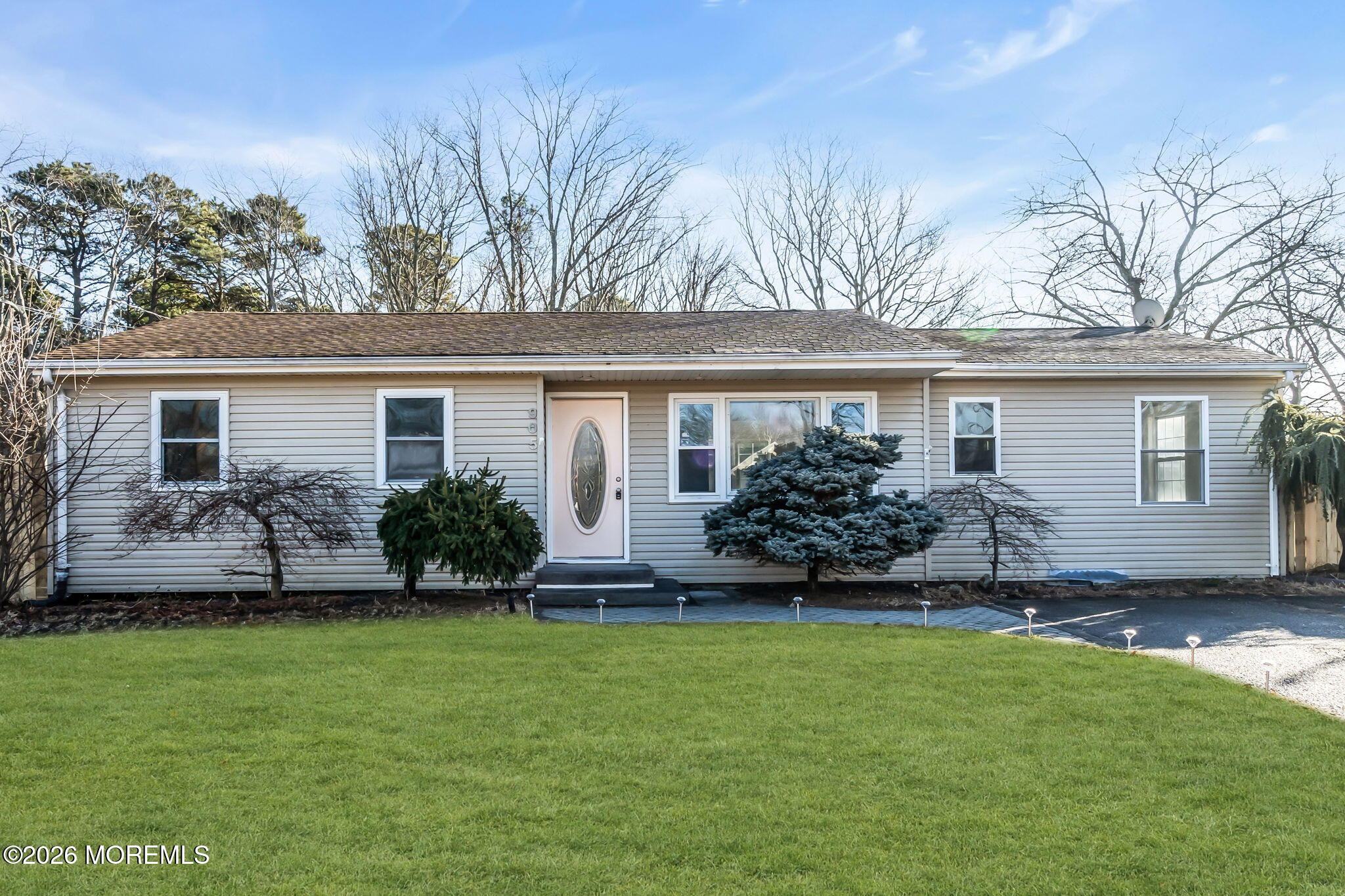 905 Harrison Road Toms River, NJ 08753 - Photo 22 of 41 a front view of a house with a garden