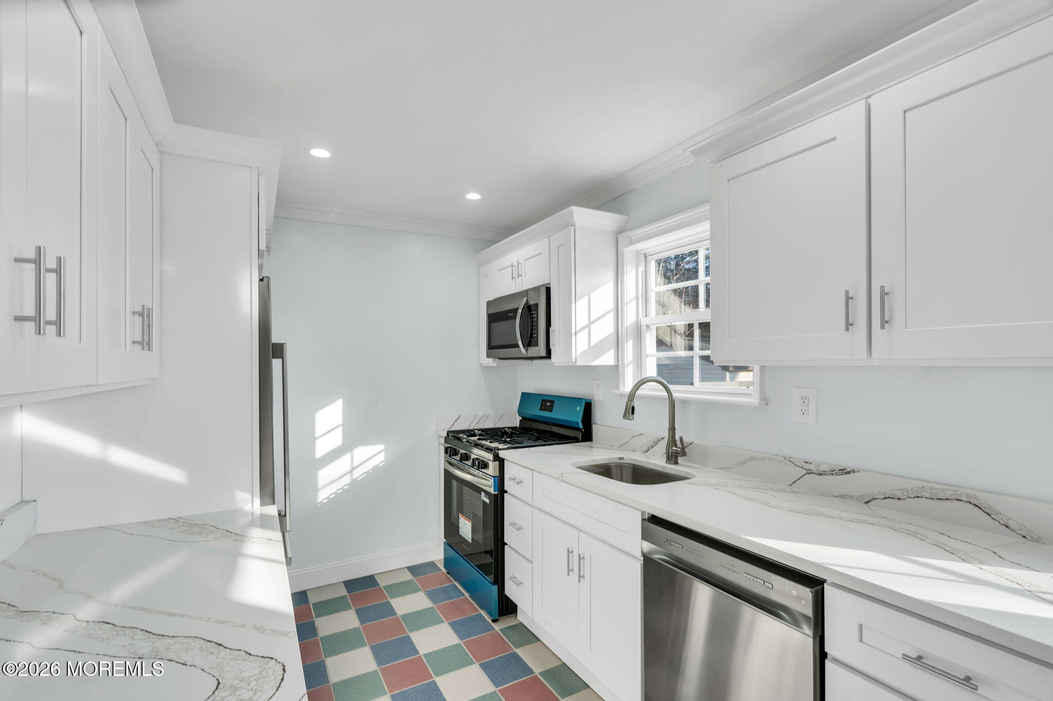 905 Harrison Road Toms River, NJ 08753 - Photo 3 of 41 a kitchen with granite countertop a sink and a stove top oven