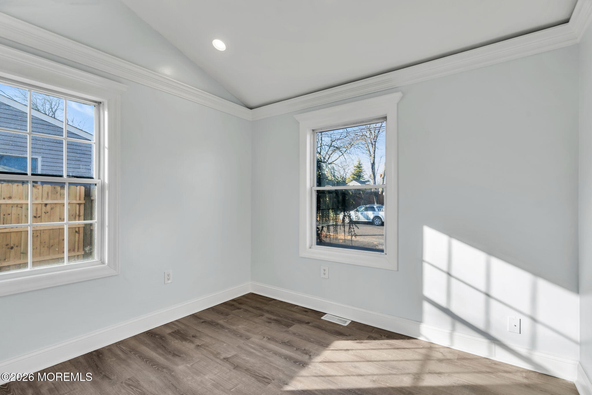 905 Harrison Road Toms River, NJ 08753 - Photo 10 of 41 a view of an empty room with a window and wooden floor